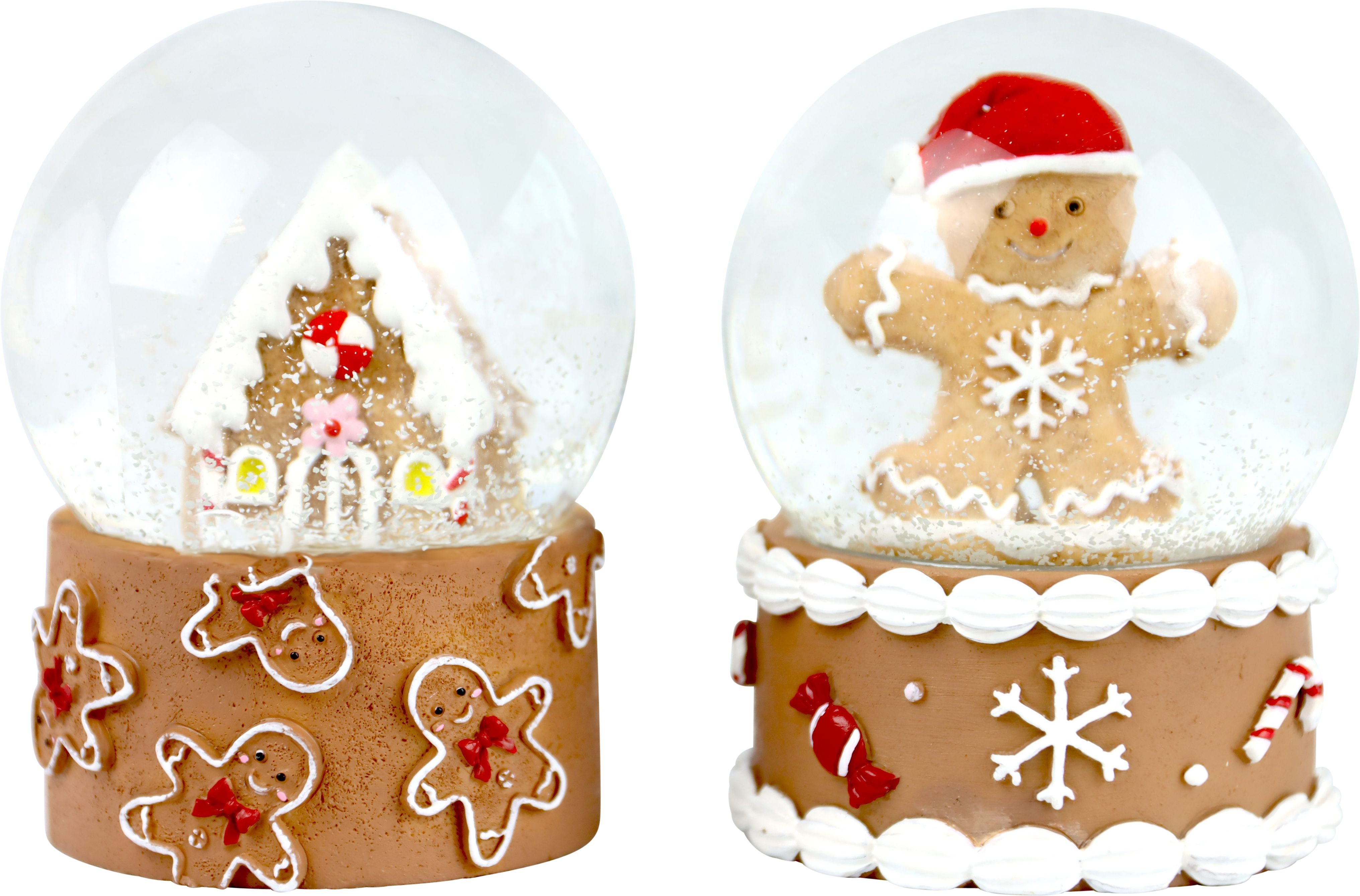 Winterzauber Schneekugel im 2er-Set, in den Farben braun, weiß und rot gestaltet, mit Kunst-Schnee in den Kugeln, in der einen Schneekugel ist ein Lebkuchenmann und in der anderen Schneekugel ist ein Lebkuchenhäuschen